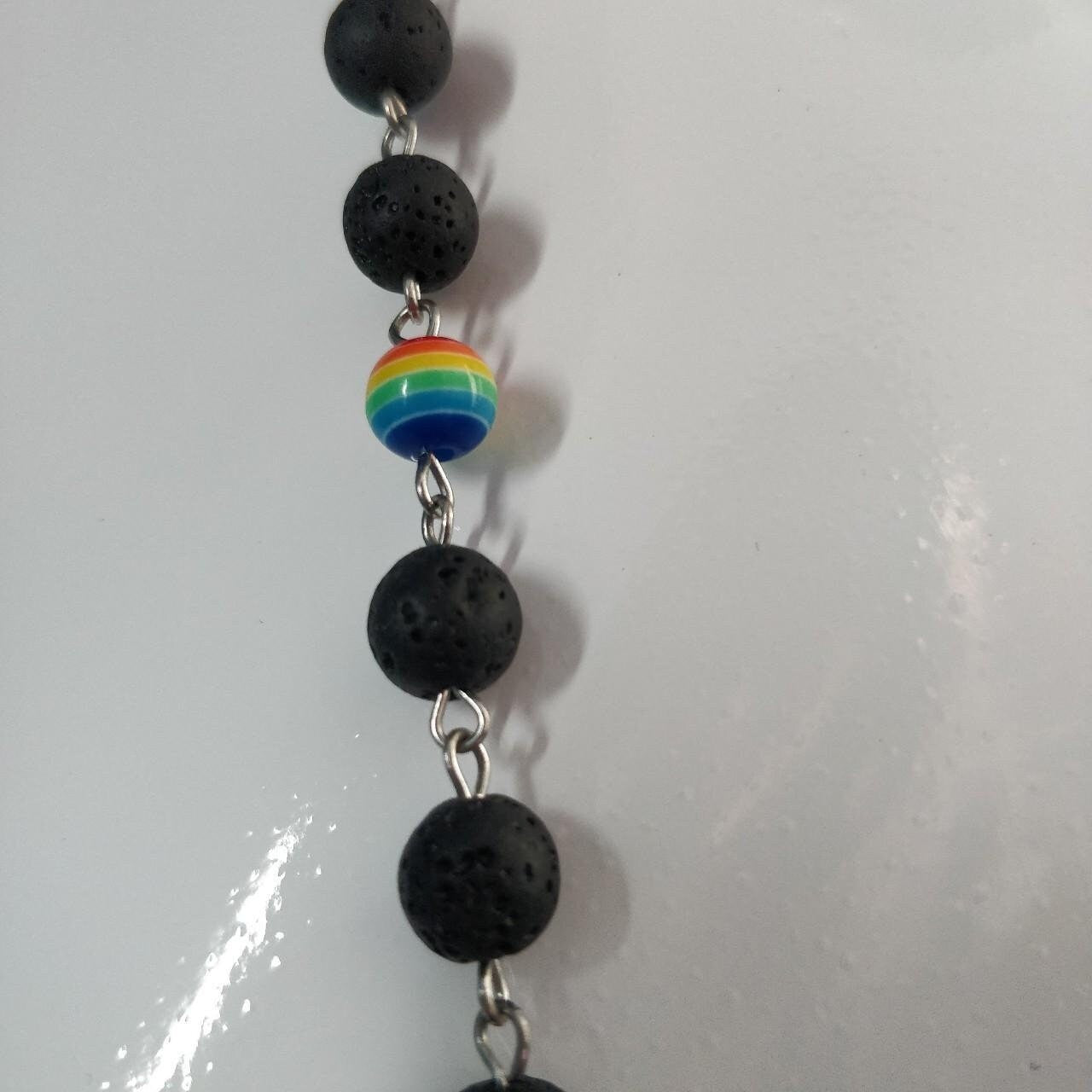 satanic temple rosary beads detail- black lava and shiny rainbow
