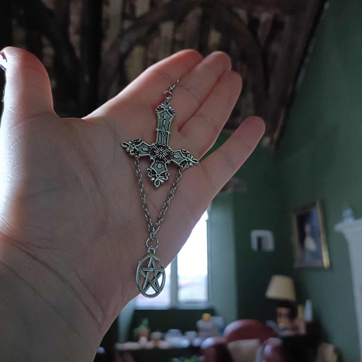 cross earrings shown in a 1400s english castle with medieval wooden beams- witchy whimsigoth scene