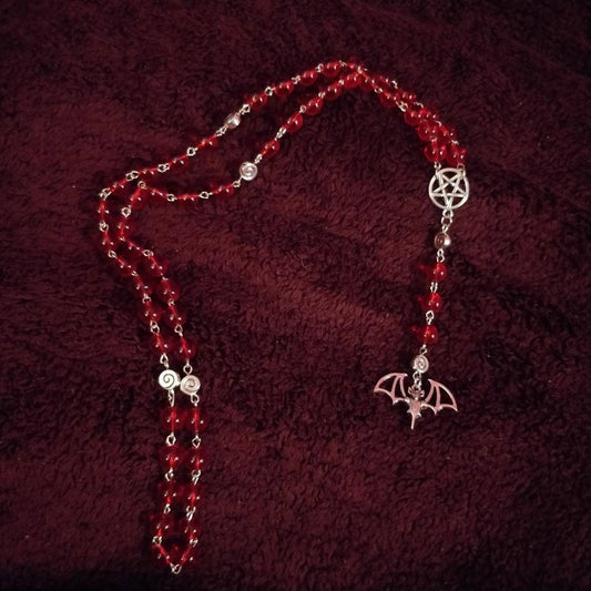 Red Bat Rosary- translucent red circular beads with bat and pentagram charms and spiral spacer beads