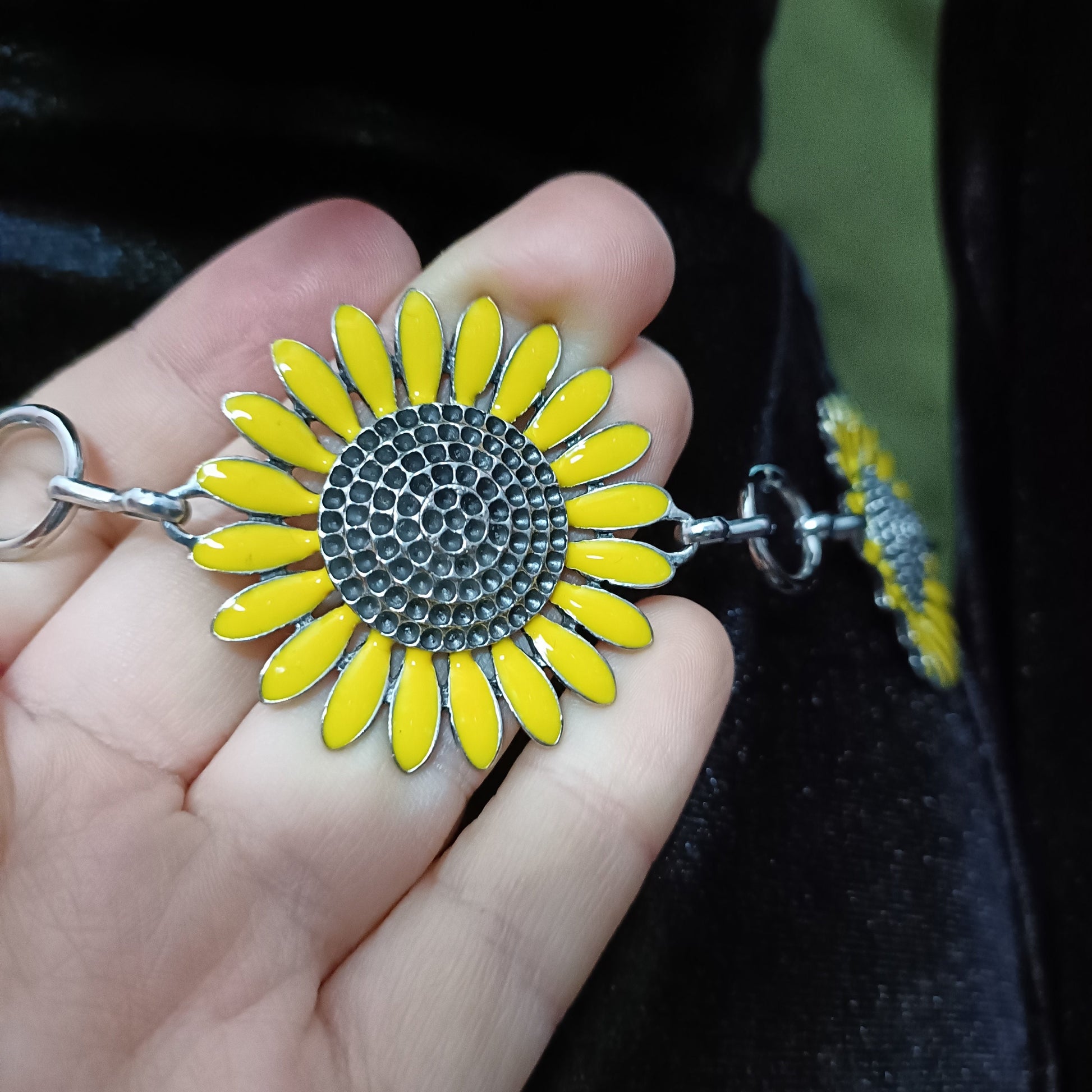 textured sunflower belt charm detail, arounf 1.5 inches wide