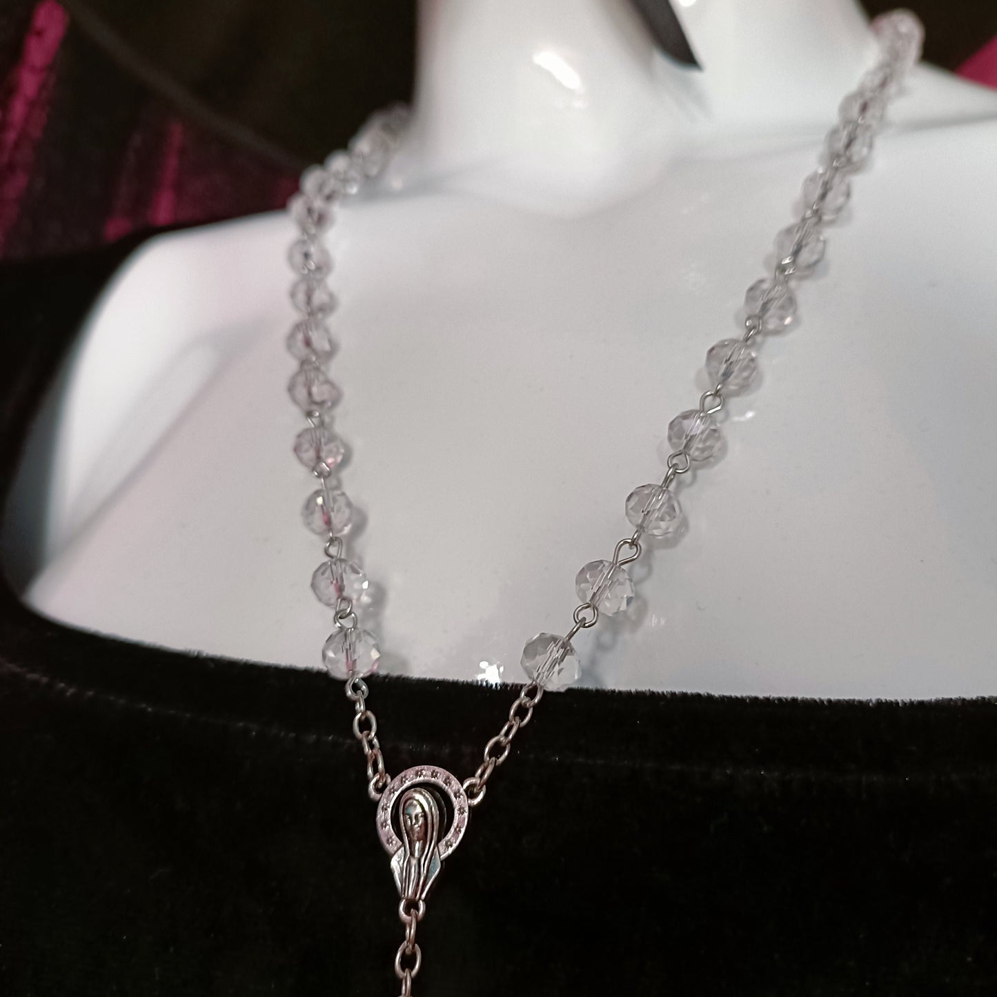 transparent beads with virgin mary surrounded by halo