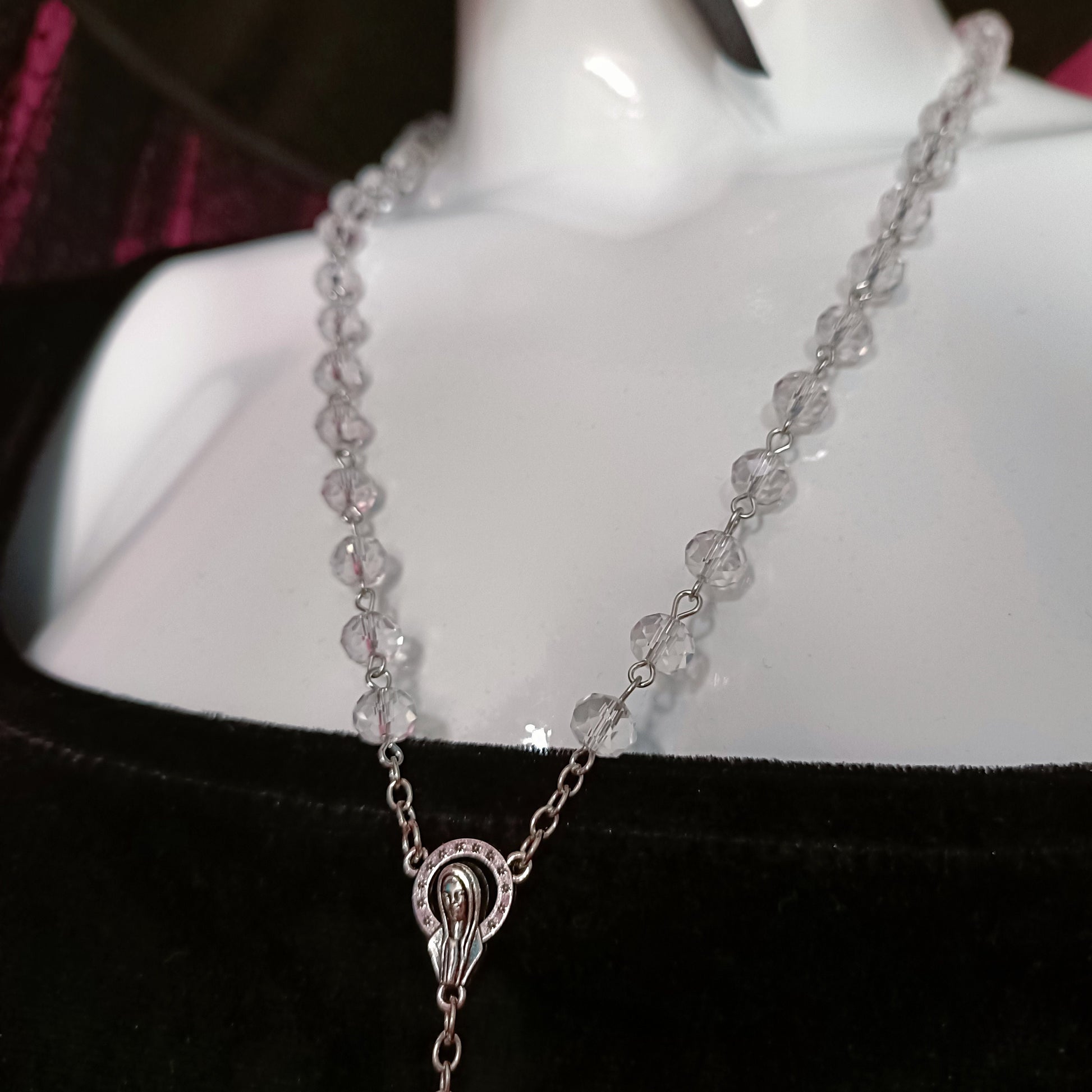 transparent beads with virgin mary surrounded by halo