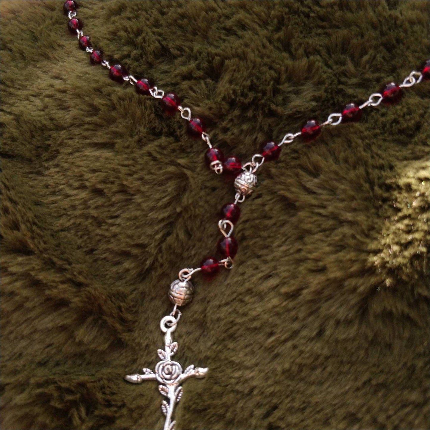 close-up-transparent-red-beads-rose-crucifix-witchy-necklace