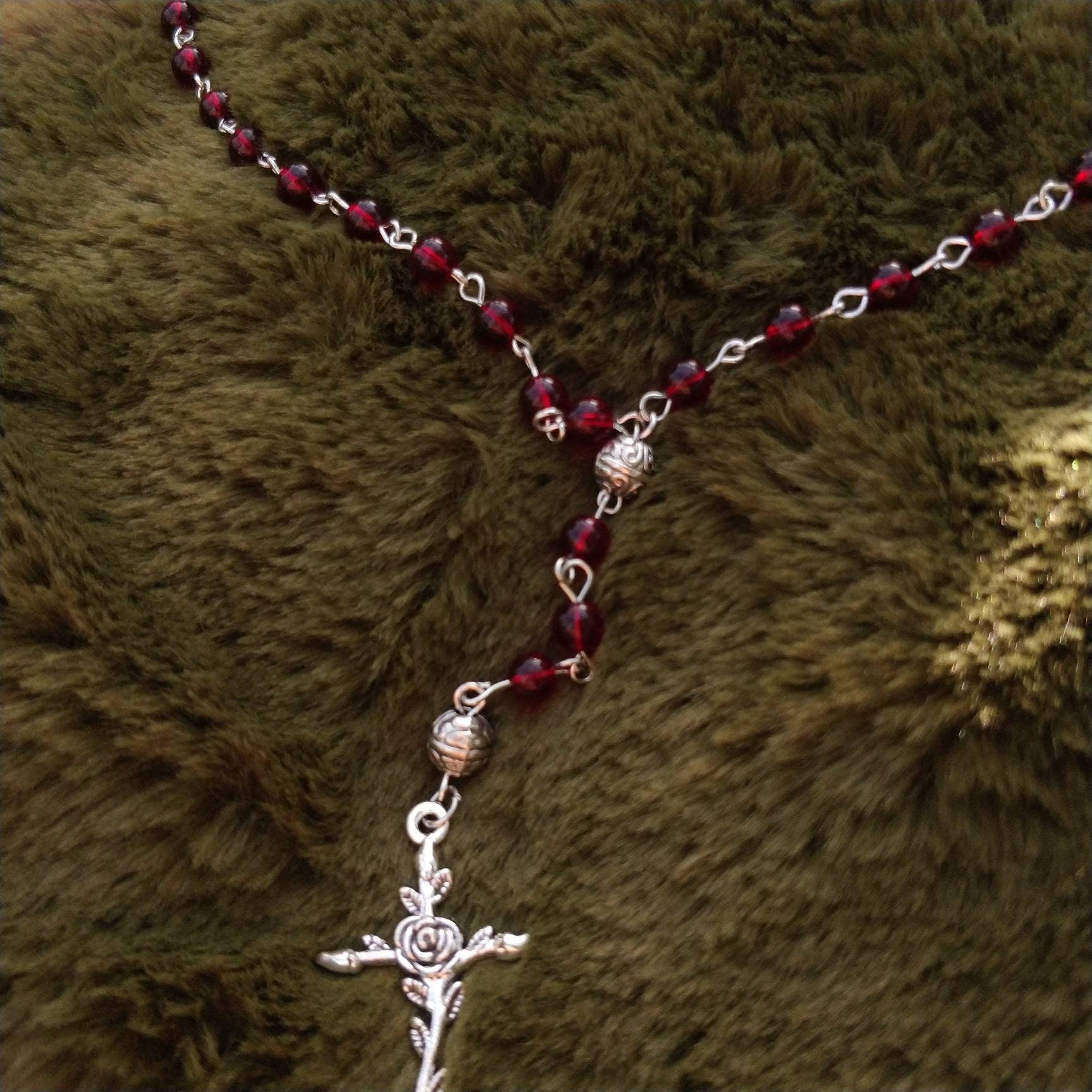close-up-transparent-red-beads-rose-crucifix-witchy-necklace