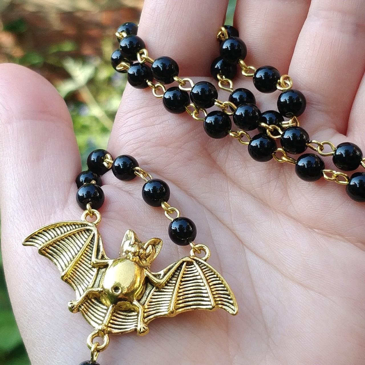 gold-carved-bat-black-prayer-rosary-beads
