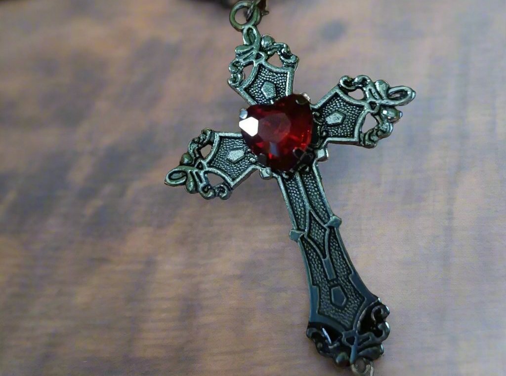 vamp earrings with red heart gem